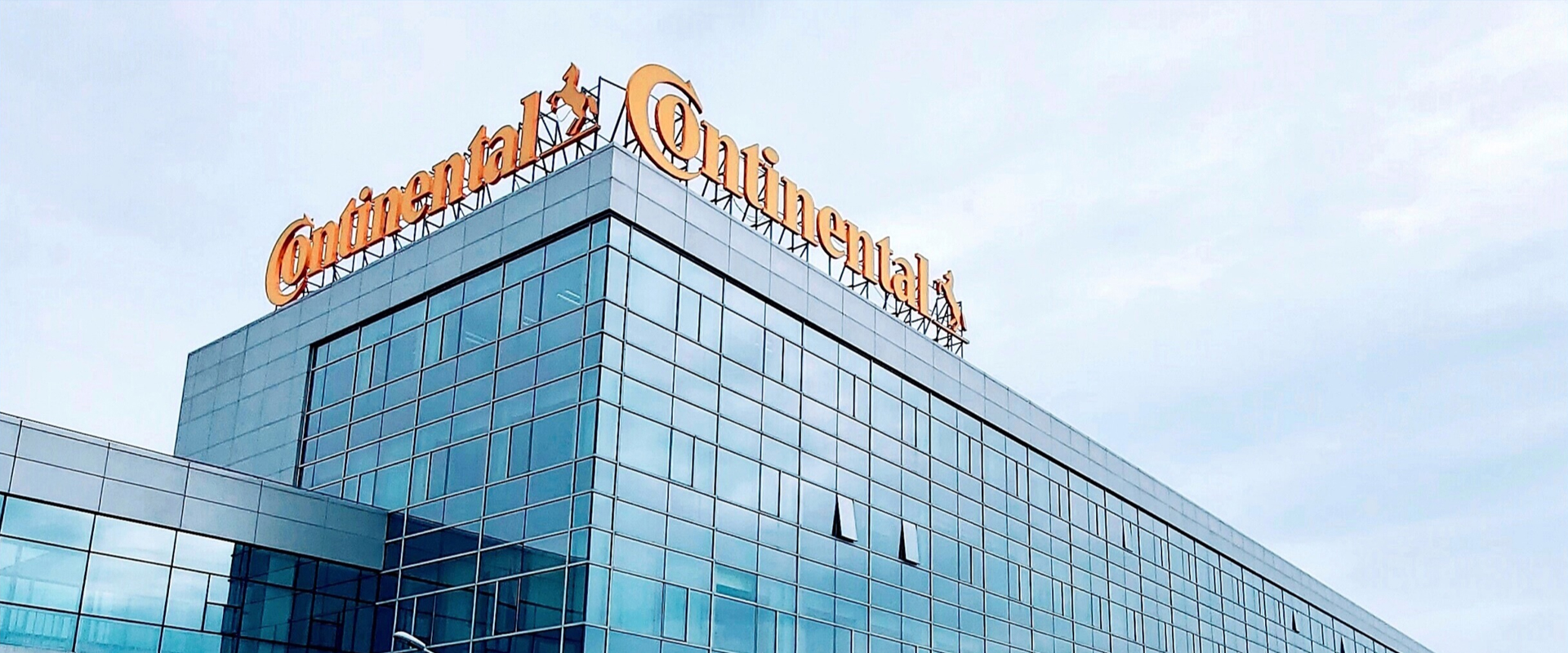 Continental headquarters building with rooftop brand signage